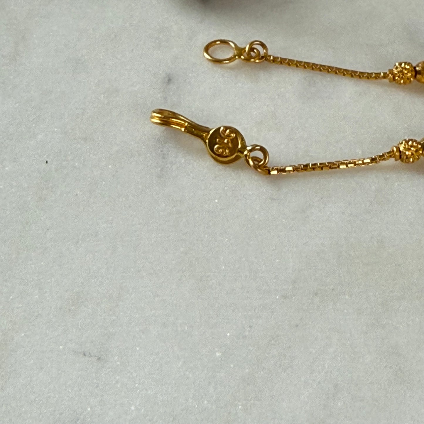 22ct gold triple beaded l 7 inches
