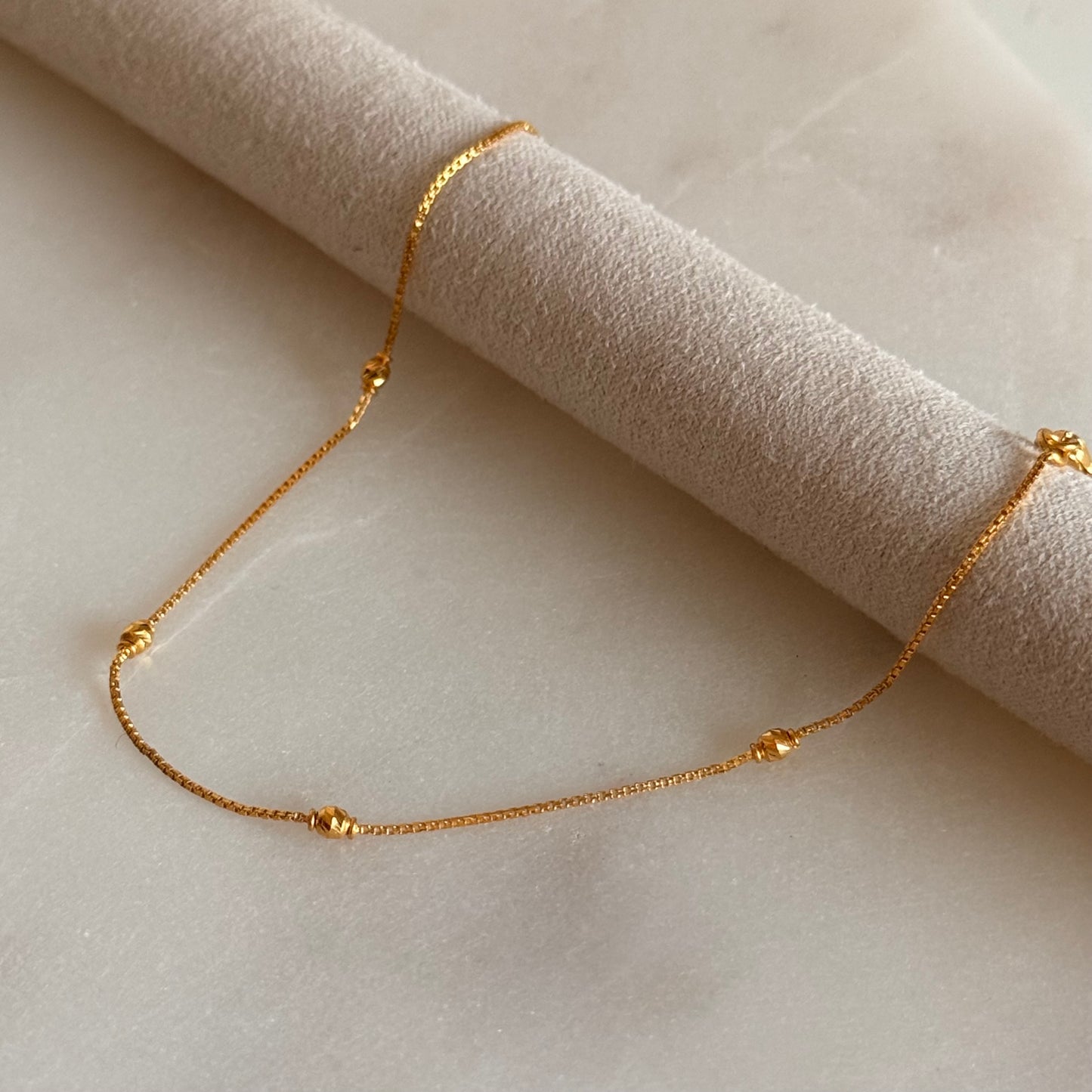 Nusaybah | 22ct gold minimal beaded bracelet