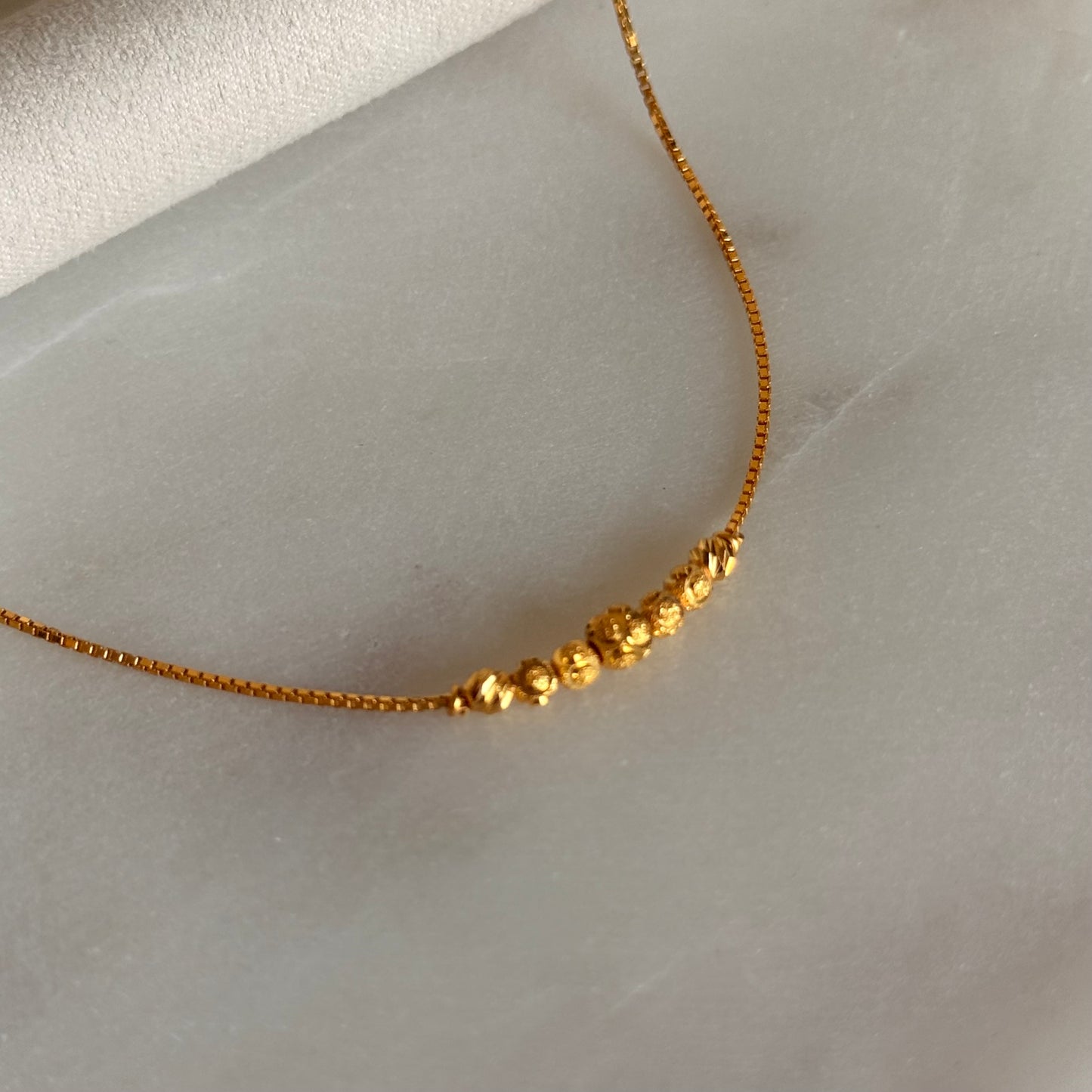 Aasiyah | 22ct gold minimal beaded bracelet