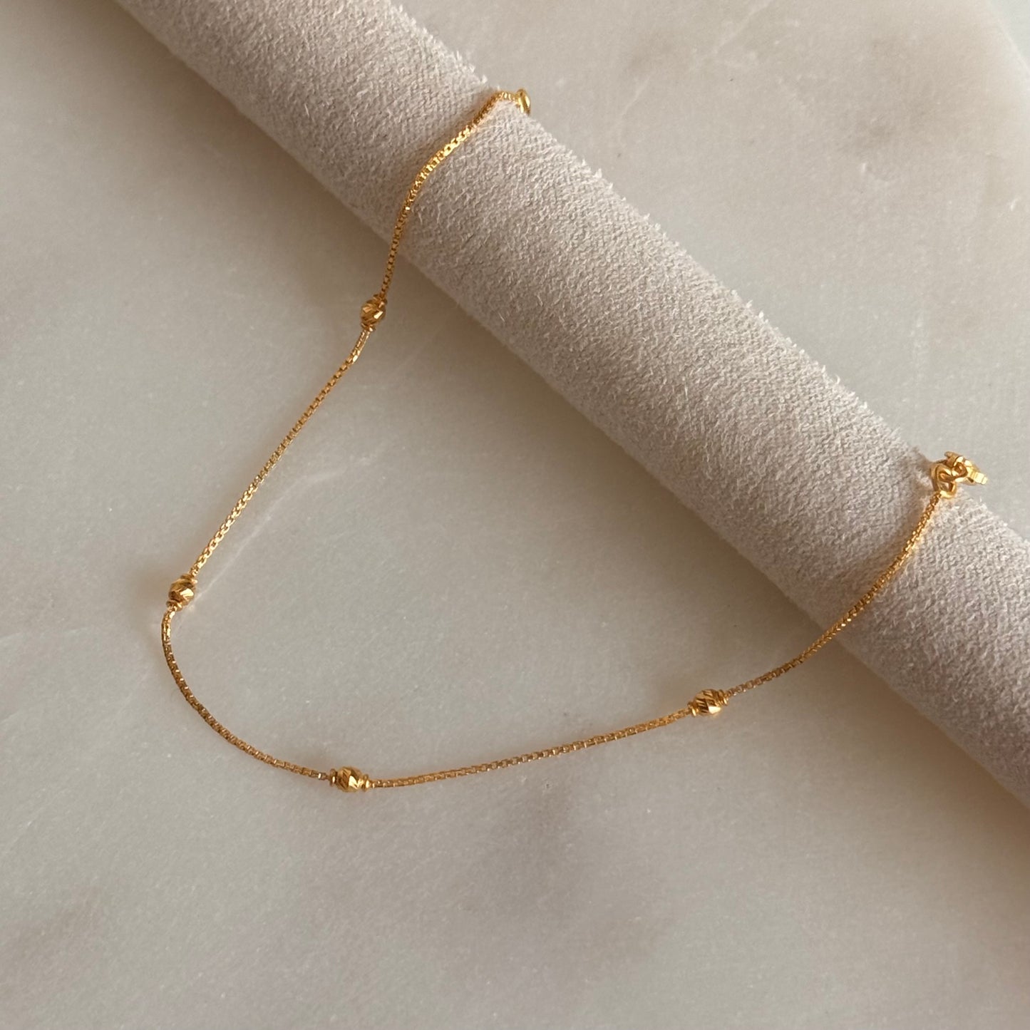 Nusaybah | 22ct gold minimal beaded bracelet